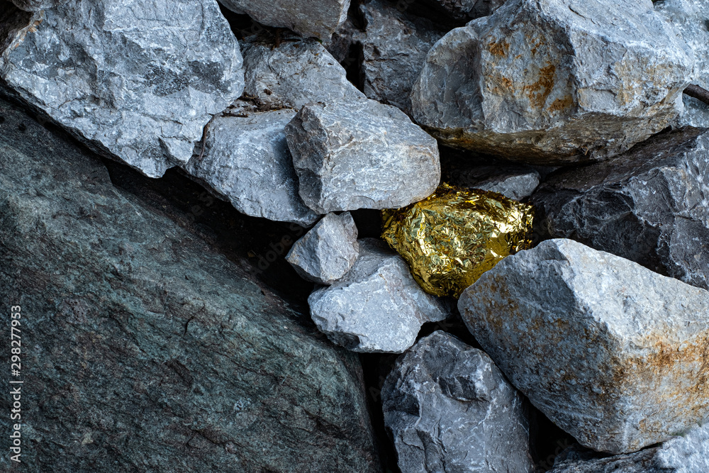 Gold nugget and grey granite stone