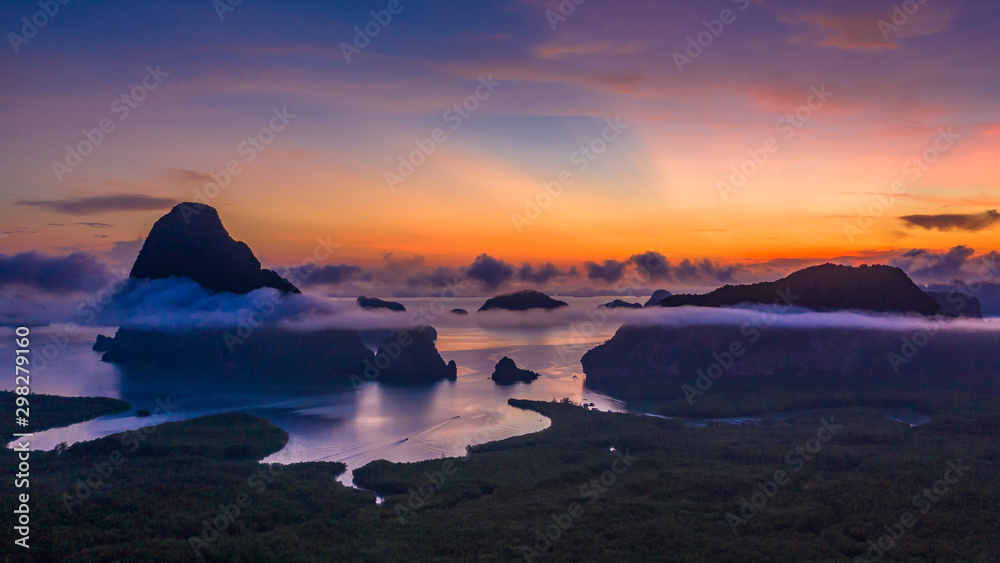 Aerial view Phang Nga Bay at sunrise with Beautiful limestone and mangrove tree forest and hills in the Andaman sea, Sametnangshe, Phang Nga, Thailand.