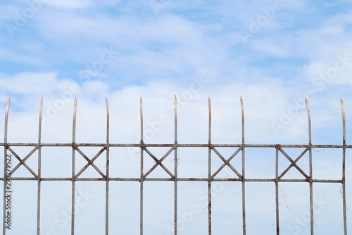 Steel fence on the sky background, security or forbidden boundary area zone