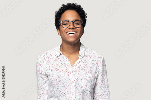 Head shot portrait laughing African American woman in glasses