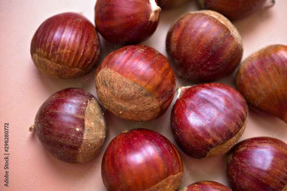 a bunch of chestnuts on a beige background a bunch of chestnuts on a beige background