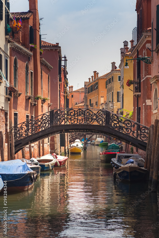 beautiful bridge with forged handrails over a canal in Venice in the Cannaregio district