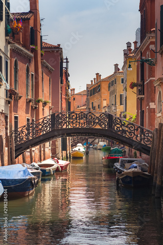 beautiful bridge with forged handrails over a canal in Venice in the Cannaregio district