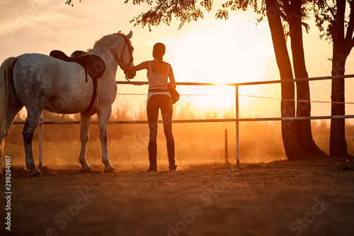 Young girl spending time with her horse