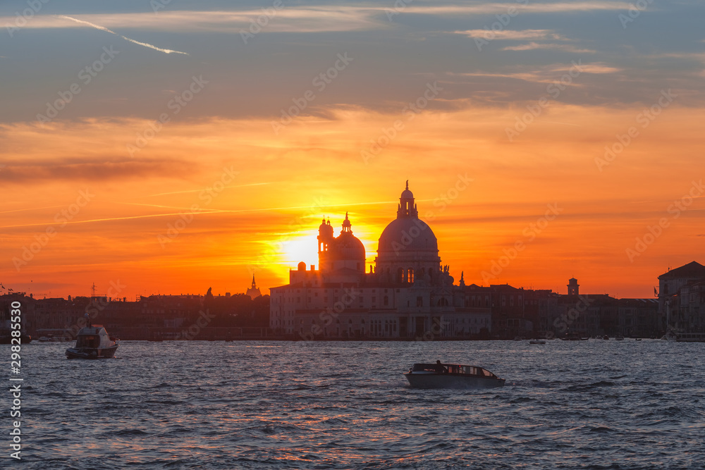 Romantic view to Punta della Dogana with Basilica Santa Maria della Salute on sunset, Venice, Italy