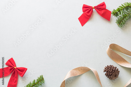 Christmas background with gift boxes, pine cone and decorations on light blue background. Preparation for holidays. Top view with copy space.
