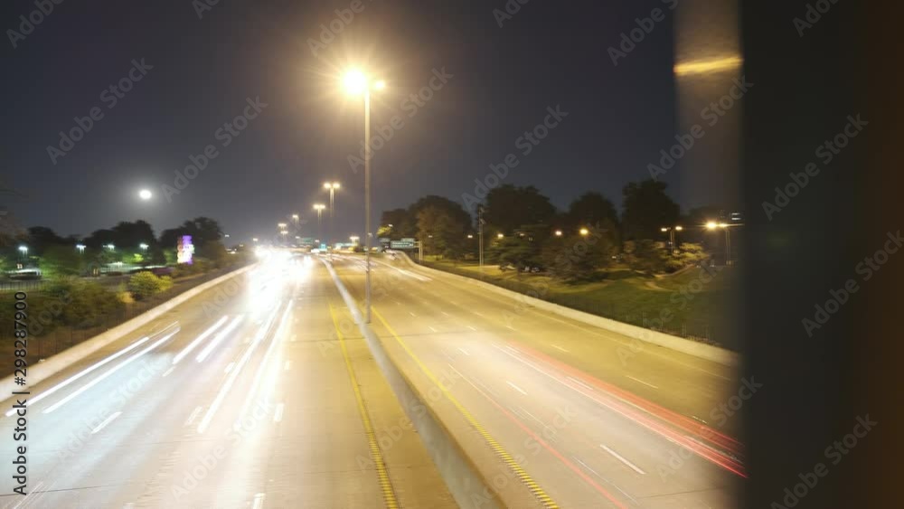 Tracking time-lapse from overpass of cars driving on freeway at night. Tracking time-lapse from overpass of cars driving on freeway at night.