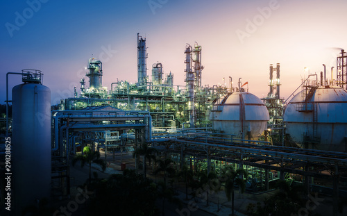 Manufacturing of petroleum industrial plant with gas storage tanks, Petrochemical plant on sunset sky background
