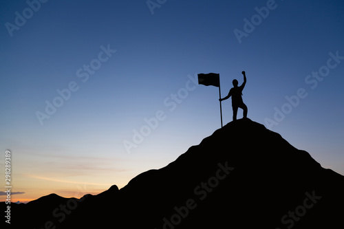 Silhouette of people and flag on top mountain, sky and sun light background. Business success and goal concept. © cofficevit