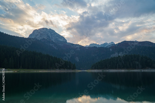 Mountain lake with coniferous forest in National Park Durmitor, Montenegro, Europe.