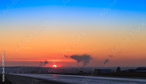 Silence on the winter highway, to the Yoshkar-Ola city. Panoramic view of Yoshkar-Ola city at sunset. Twilight time. © Evgesha