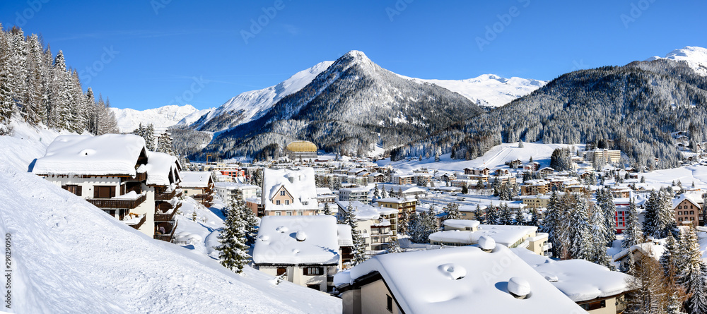 Panoramic landscape of winter resort Davos - the home of annual  World Economy Forum. - obrazy, fototapety, plakaty 