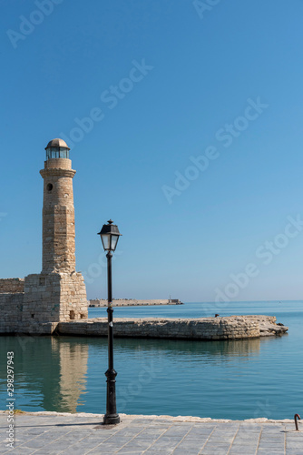Rethymno, Crete, Greece. October 2019. The ancient lighthouse on the old historic Venetion Harbour at Rethymno, Crete.