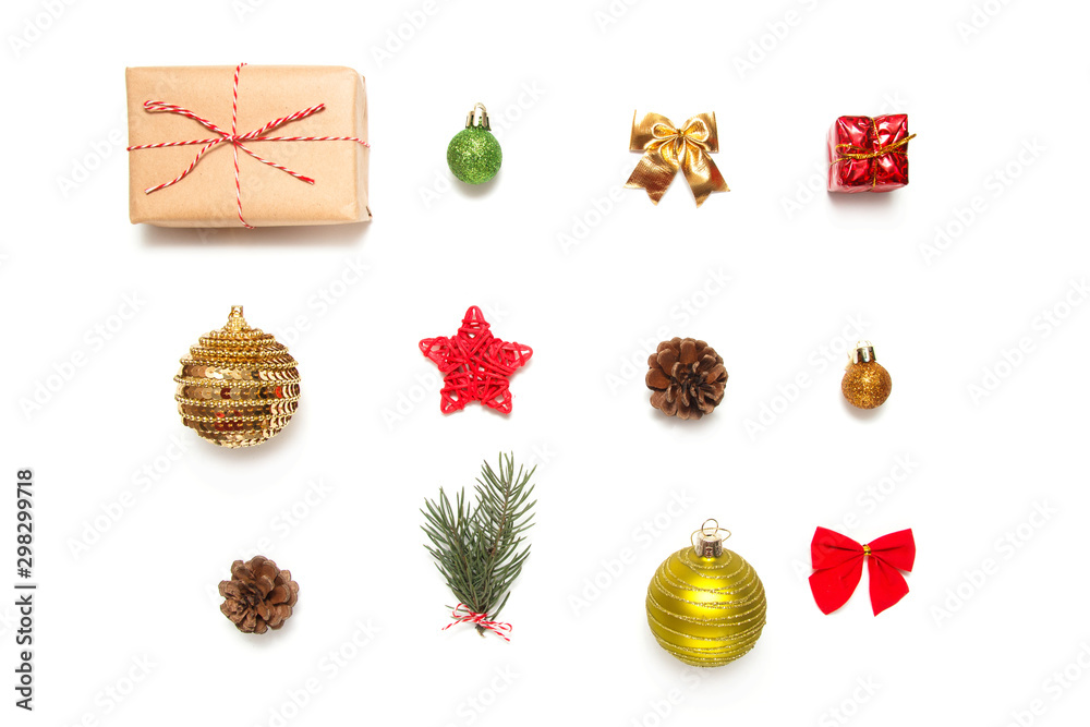 Christmas composition. Christmas tree branch, pine, gift and decorations on white background. Flat lay, top view, copy space.