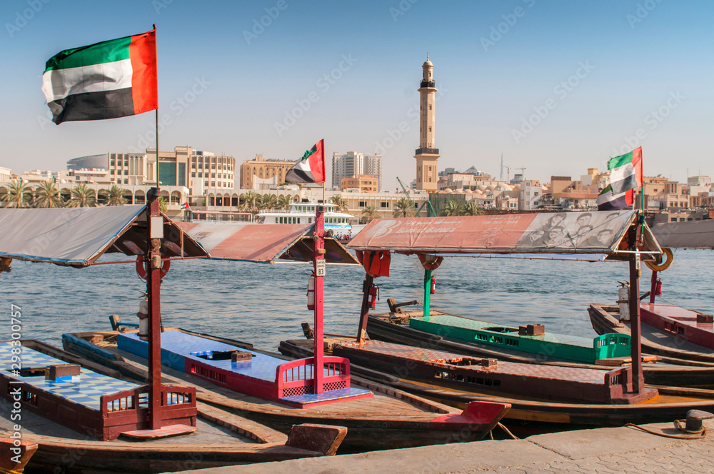Old traditional boats on the bay Creek in Dubai, United Arab Emirates.