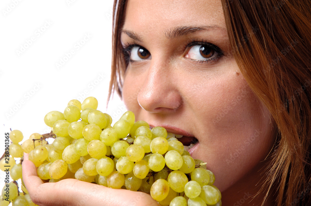 Hungry girl wants to eat delicious juicy grapes Hungry girl wants to eat delicious juicy grapes