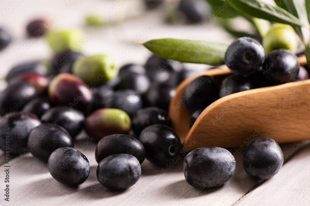 Green and black olives  on table.
