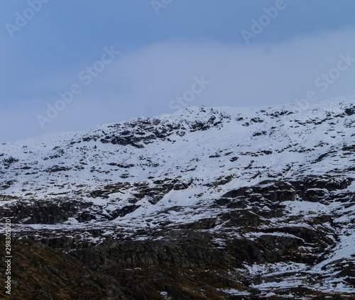 Mountains tops with snow and clouds