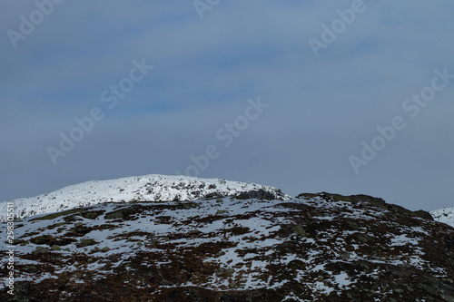 Mountains tops with snow and clouds