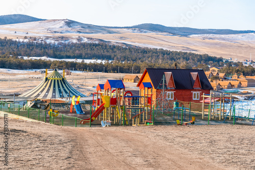 Colorful funny playground at Olkhon Island park Baikal lake in winter day, Russia photo