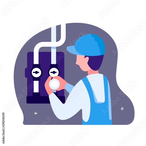 A male plumber is repairing pipes and water meters. A man in blue overalls and a cap. He blocks the water in the pipes. The concept of maintenance of industrial equipment and plumbing
