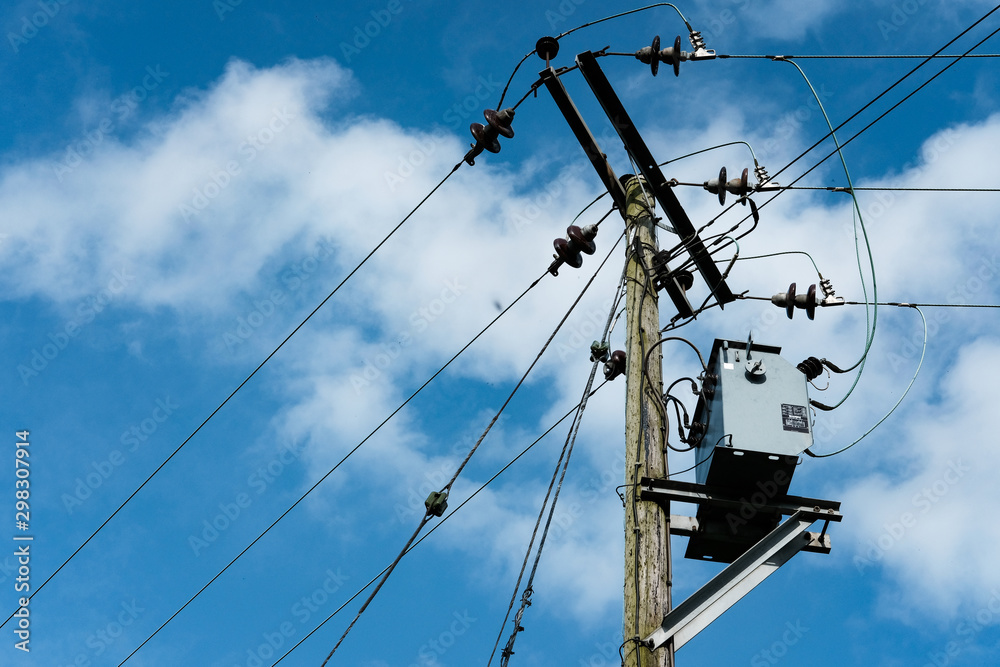 Detailed view of a high power electrical cabling system seen atop a utility pole. Detailed view of a high power electrical cabling system seen atop a utility pole.