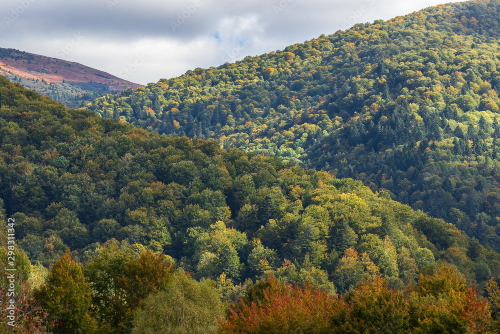 High mountains and blue cloudy sky. Autumn landscape. Panoramic view.