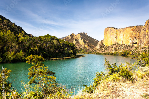 Nice and peaceful view of the lake with a rocky mountains blackground. Sant LLoren   swamp. Catalonia.  Segre river.