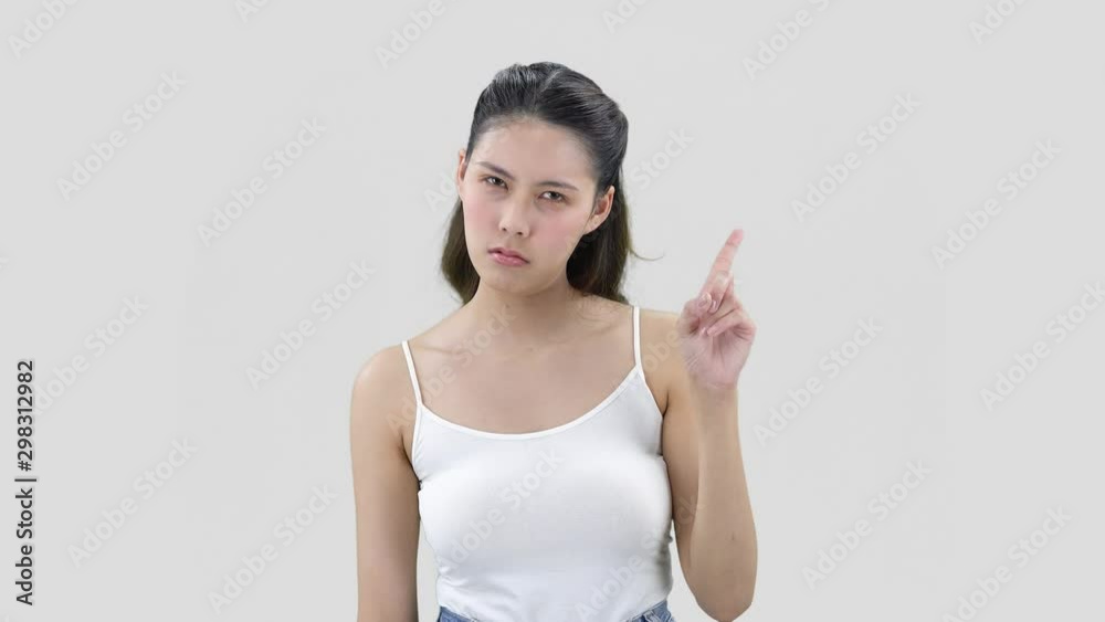 beautiful asian young woman with black hair negatively shakes head, wags finger beautiful asian young woman with black hair negatively shakes head, wags finger
