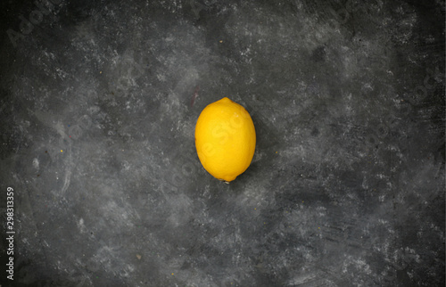 Yellow lemon fresh on black background.