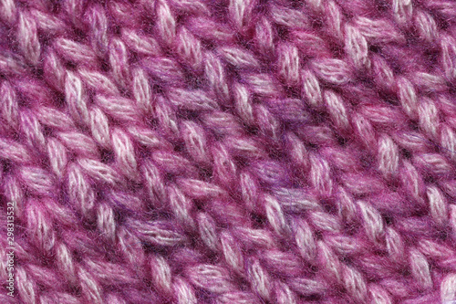 Violet textured Knitted background. Close up of  wool fabric texture.