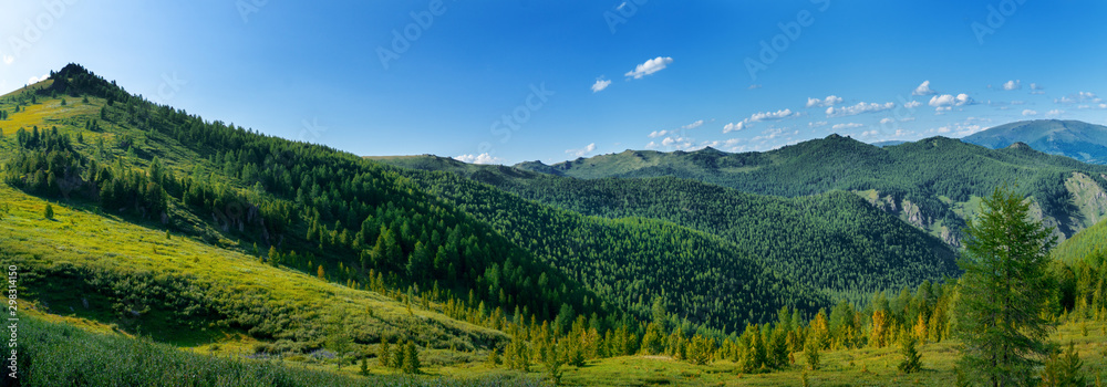 Mountainous landscape, picturesque mountain range in the summer morning.