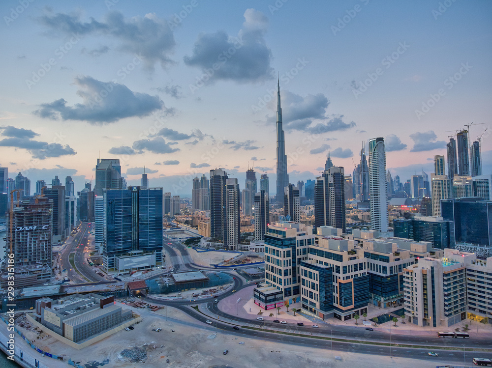 Obraz premium DUBAI - DECEMBER 2016: Aerial view of Downtown Dubai and City River at sunset. Dubai is the major city in UAE