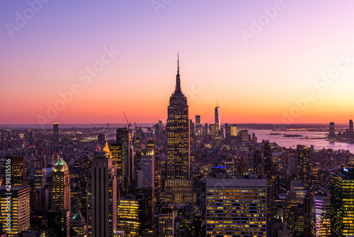 New York City skyline with cityscape and skyscraper in Manhattan at sunset.