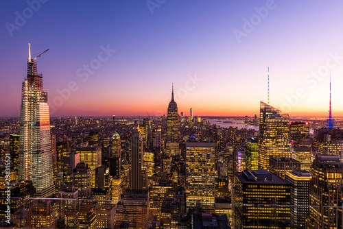 New York City skyline with cityscape and skyscraper in Manhattan at sunset.