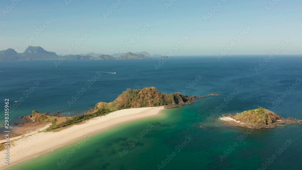 Aerial drone blue sea and tropical beach. Nacpan, El Nido, Palawan, Philippine Islands. Seascape with tropical beach and islands. Summer and travel vacation concept Aerial drone blue sea and tropical beach. Nacpan, El Nido, Palawan, Philippine Islands. Seascape with tropical beach and islands. Summer and travel vacation concept