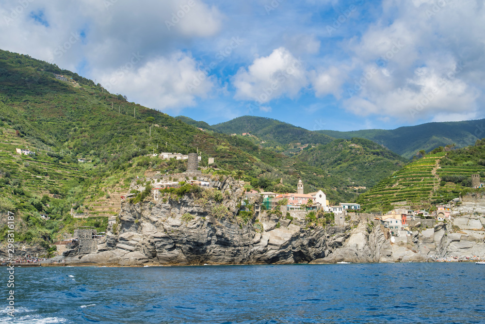 Ligurian Sea coast, view of coastal cliffs, beach, old lookout tower, Italy