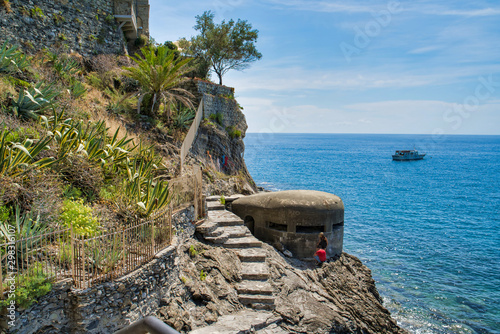 Obraz na płótnie In the mountains of Liguria by the sea, a protective old structure. Sea view from a hiking trail, Italy w salonie