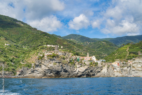 Ligurian Sea coast, view of coastal cliffs, beach, old lookout tower, Italy