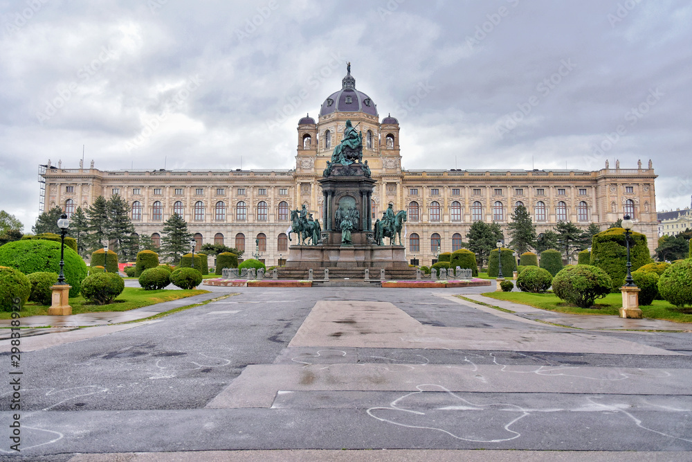 Fototapeta premium Vienna, Austria - April, 2019. Hofburg, palace and park complex of the Hofburg, Austria. Streets of Vienna's old town with tourist attractions. Square of the imperial palace on a rainy day