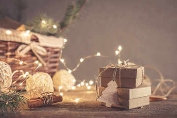 Christmas and zero waste, eco friendly packaging gifts in kraft paper on a wooden table, eco christmas holiday concept, eco decor