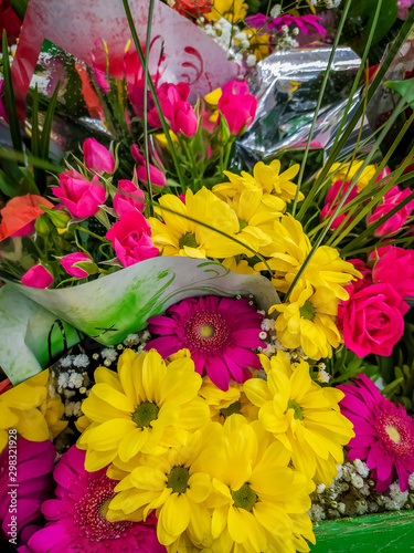 Fototapeta Naklejka Na Ścianę i Meble -  Bouquets of flowers in the supermarket . Ready-made bouquets. Flowers on the occasion. Beautiful bright flowers.