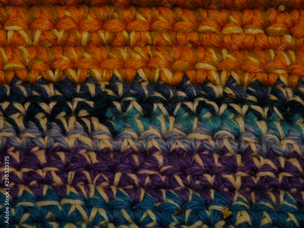 Fototapeta premium the texture of the knitted fabric is a thick multi-colored thread