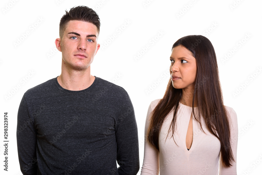 Curious woman staring and looking at handsome man Curious woman staring and looking at handsome man