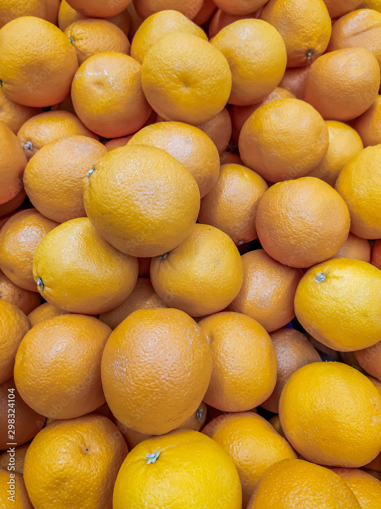 Lots of oranges . Background oranges . Fruit on the counter of the store. Huge selection of oranges. Lots of oranges . Background oranges . Fruit on the counter of the store. Huge selection of oranges.