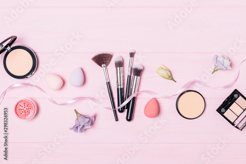 Flat lay makeup products and brushes