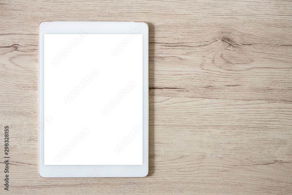 isolated white tablet on wooden table isolated white tablet on wooden table