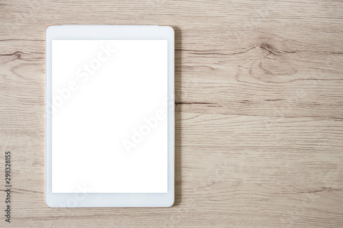 isolated white tablet on wooden table
