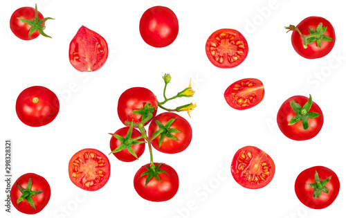 Tomatoes whole and sliced on white background isolated, top view