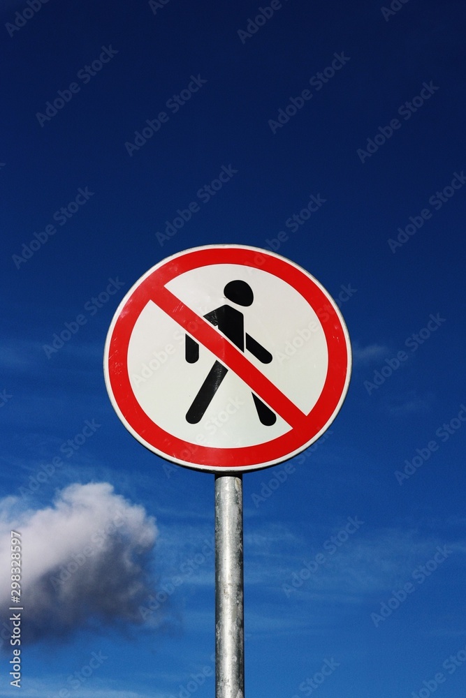 Road sign pedestrians are forbidden to pass with the sky Road sign pedestrians are forbidden to pass with the sky